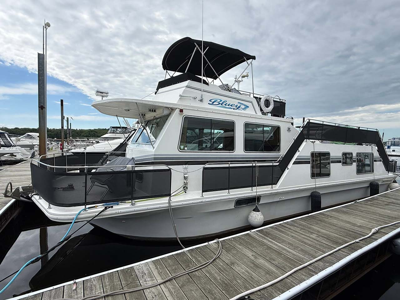 Cabin cruiser docked at a marina for inspection